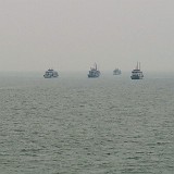 On the Way to Halong Bay  It's almost like a highway, the sea between Halong City and the main parts of Halong Bay. Dozens and dozens of boats are heading to the same places at the same time.